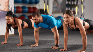 A group of people doing push-ups