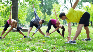 A group of people doing exercise outdoors