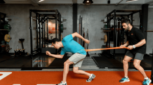 A man doing strength training with his personal trainer