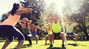 A group of people doing workout with personal trainer gold coast
