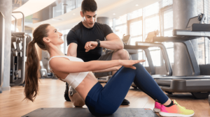 A personal trainer counting while a trainee executing the workout