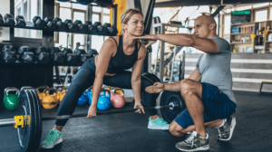 A woman about to lift a dumbbell