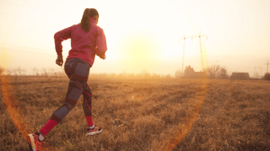 A woman jogs early in the morning