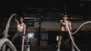 A couple working with battle ropes