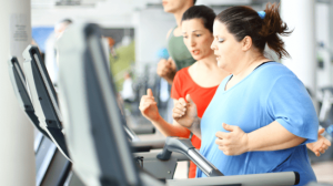 A fat woman running in a treadmill